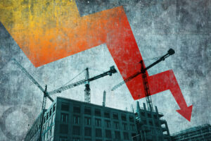 Imge of tower cranes working above a half-finished building, overlaid with a dramatic red and orange arrow pointing downward.